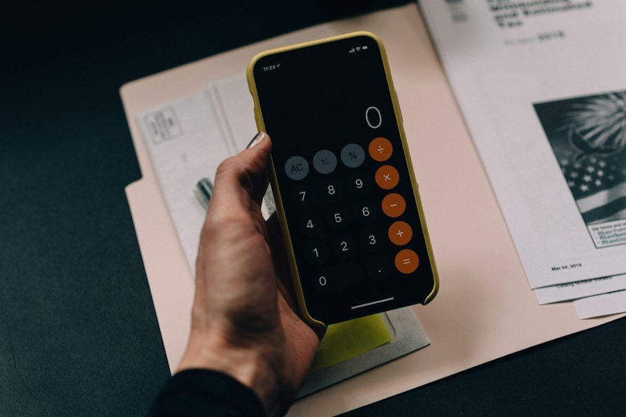 Calculator and paperwork used to track invoices and payments